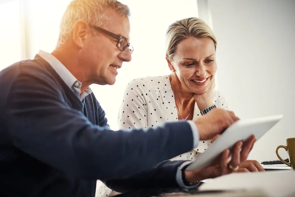 Financial services Brisbane adviser meeting with clients to plan insurance, income protection and investments