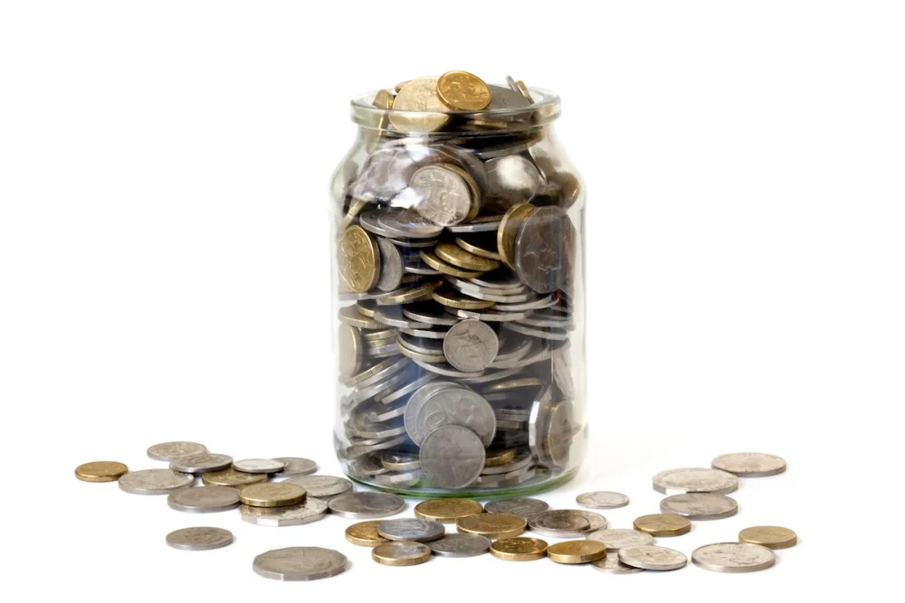 Jar of coins, the other costs Queensland first home buyers should budget for beyond stamp duty